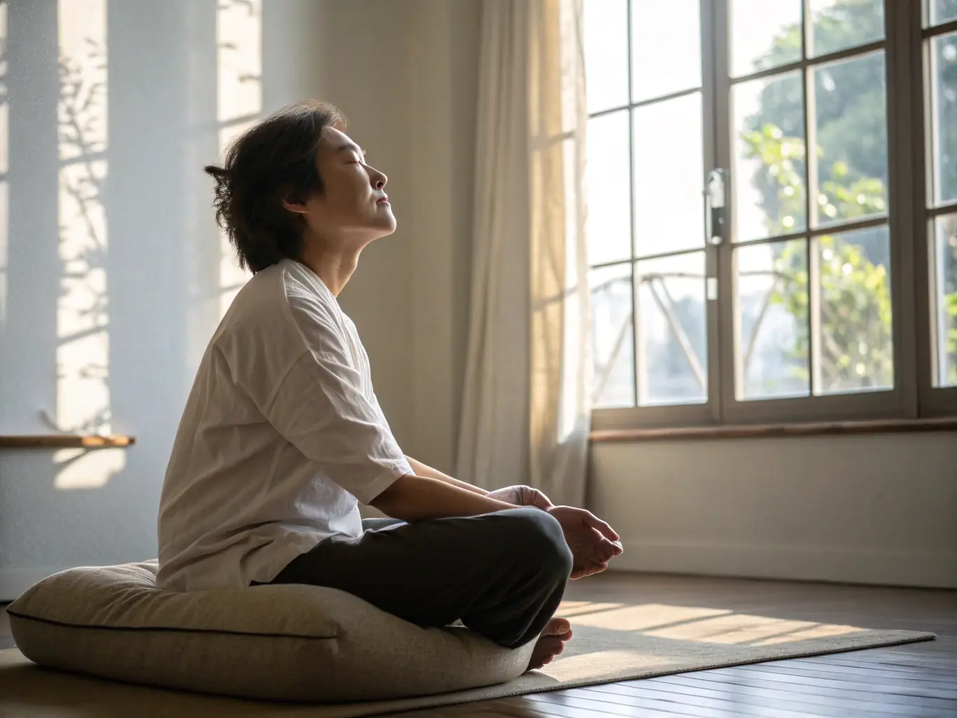 An image depicting a person meditating in a serene office environment, symbolizing mental clarity and focus, with soft, natural lighting.